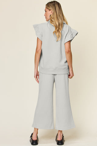 Double Take Texture Ruffle Short Sleeve Top and Drawstring Wide Leg Pants Set Trendsi