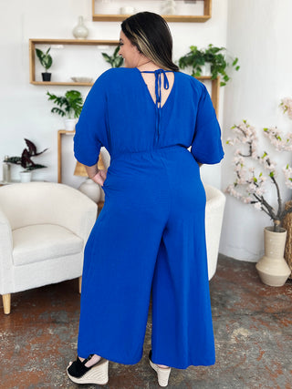 Double Take Full Size Surplice Wide Leg Jumpsuit with Pockets Trendsi