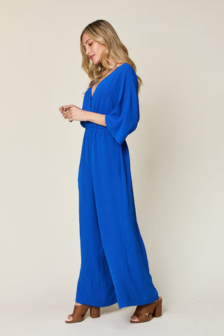 Double Take Full Size Surplice Wide Leg Jumpsuit with Pockets Trendsi