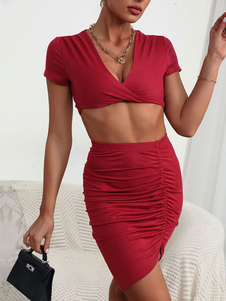 Perfee Twisted Deep V Cropped Top and Ruched Skirt Set Trendsi