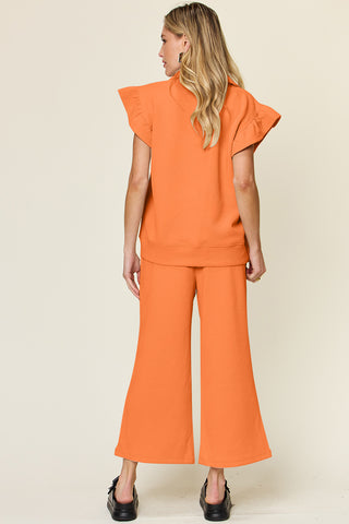 Double Take Texture Ruffle Short Sleeve Top and Drawstring Wide Leg Pants Set Trendsi